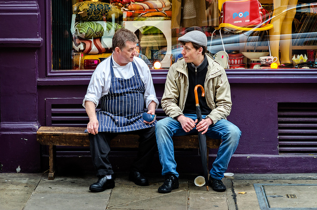 two men in front of a store